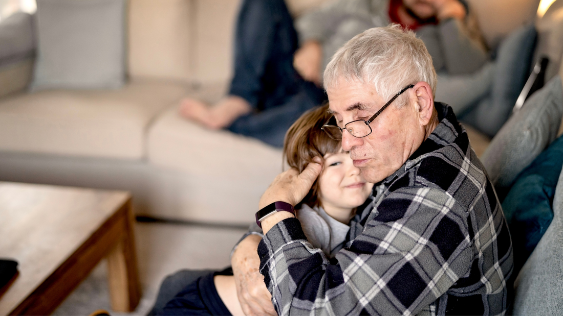 Grandfather embracing his grandson